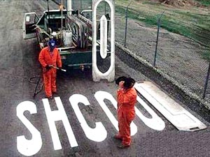 sign painted on road: SHCOOL